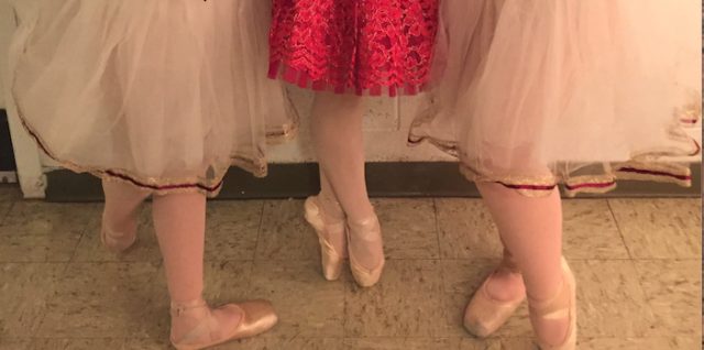 Three pairs of pointe shoes